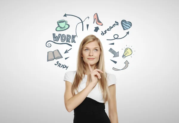 Thoughtful businesswoman with sketch — Stock Photo, Image