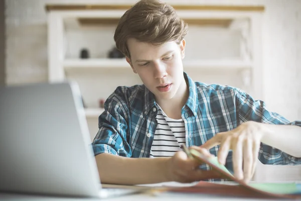 Young man doing homework