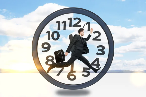 Businessman inside clock — Stock Photo, Image