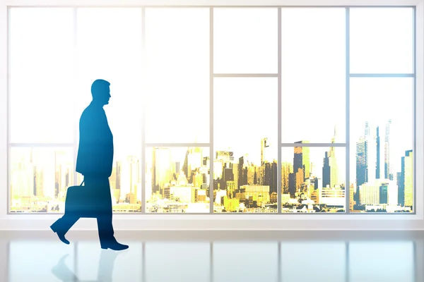 Businessman silhouette walking in room — Stock Photo, Image