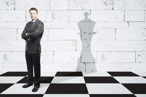 Businessman with king piece shadow — Stock Photo, Image