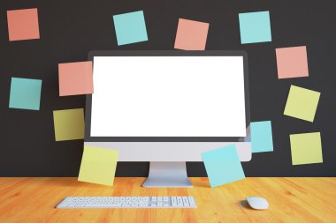 White computer screen with stickers