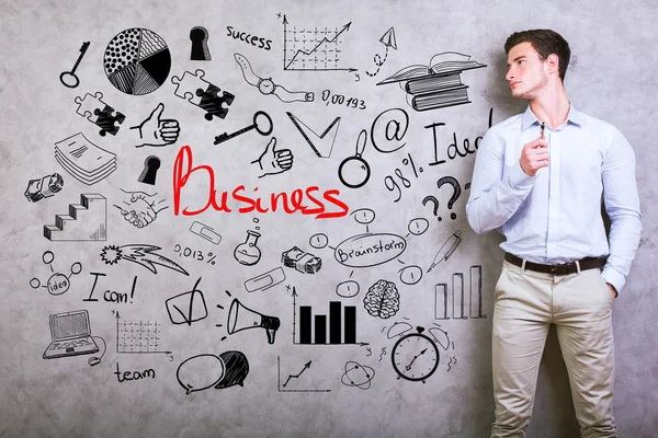 Jovem com doodle de negócios — Fotografia de Stock