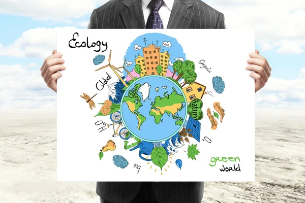 Businessperson in suit holding creative sketching of globe with natural healthy lifestyle icons on desert wall background. Eco concept