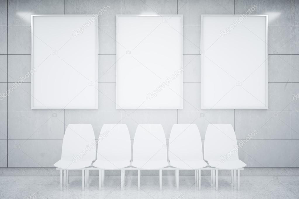 Blank posters and white chairs