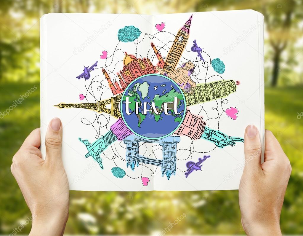 Girl's hands holding open copybook with creative colorful travel doodle on blurry green background. Traveling concept