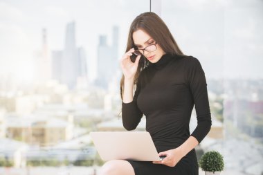 Young female using laptop computer 