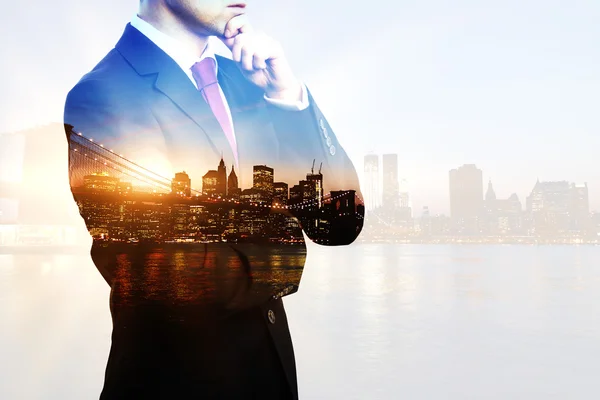 Businessperson on city background multiexposure — Stock Photo, Image