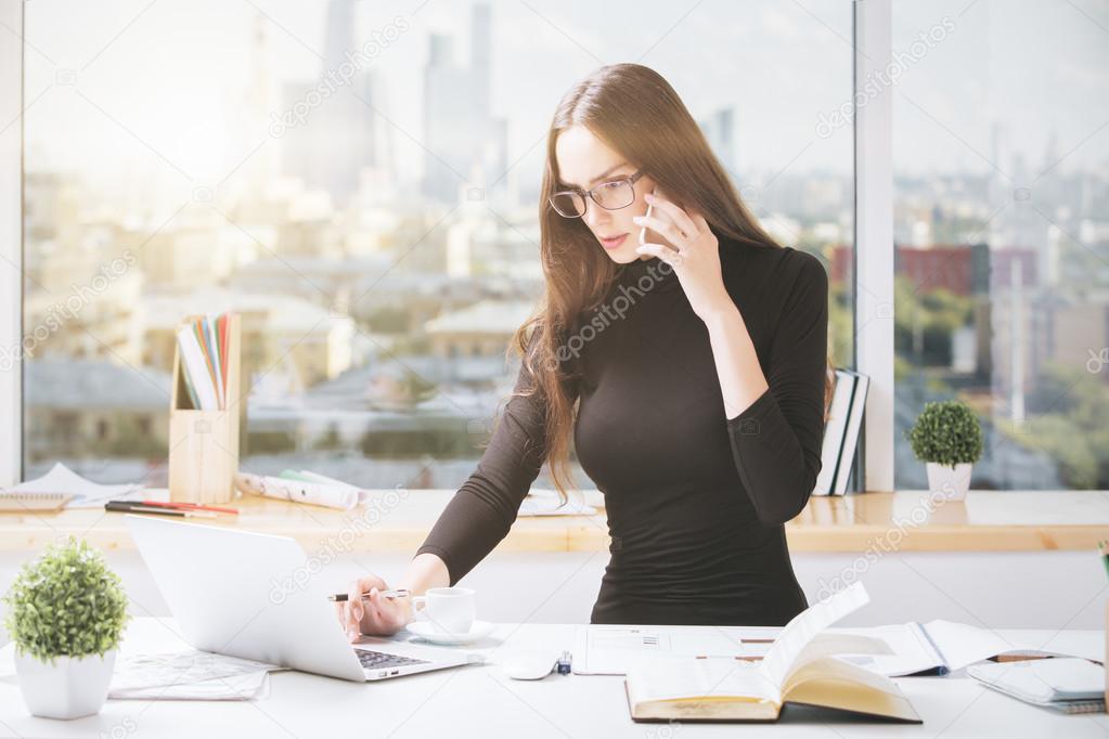 Concentrated businesslady working in office