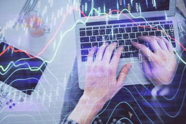 Dizüstü bilgisayar klavyesini ve ön x çizim hologramını yazarken çift pozlama. Üst Manzara. Finans piyasası kavramı.