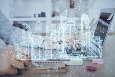 Arka planda bilgisayar üzerinde çalışan bir iş adamı ile yüksek teknoloji şehir çizimi. Akıllılık konsepti. Çift pozlama.