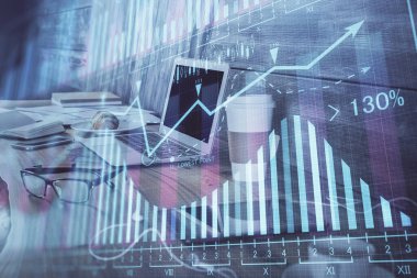Finansal pazar grafiği hologramı ve kişisel bilgisayar arka planda. Çoklu maruz kalma. Önx kavramı.