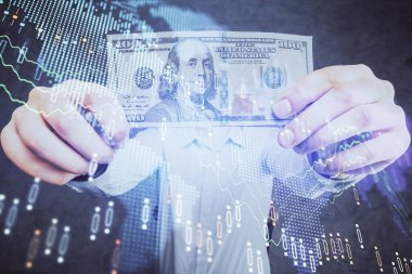 Finansal grafiğe çoklu pozlama hologram, Amerikan dolarları ve insan eli. Analiz kavramı.