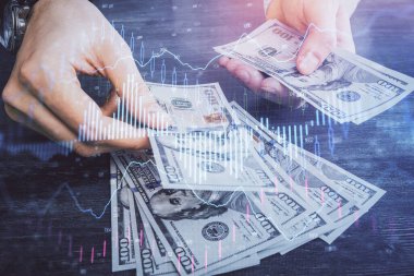 Finansal grafiğe çoklu pozlama hologram, Amerikan dolarları ve insan eli. Analiz kavramı.