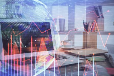 Finansal pazar grafiği hologramı ve kişisel bilgisayar arka planda. Çoklu maruz kalma. Önx kavramı.