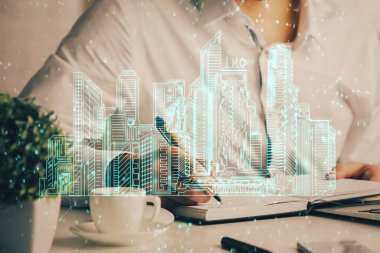 Erkeklerin el yazısı üzerine soyut holografik şehir. Çoklu pozlama.