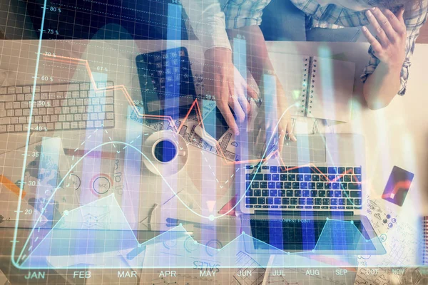 Double exposure of man and woman working together and financial graph hologram drawing. market analysis concept. Computer background. Top View. — Stock Photo, Image