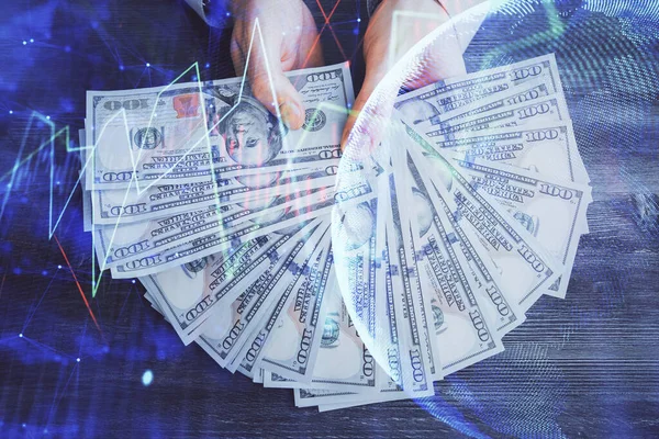 Exposition multiple de l'hologramme de dessin de graphique financier et des billets de dollars américains et des mains d'homme. Concept d'analyse. — Photo