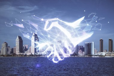 Şehir manzarası arka planında el sıkışma hologramına çifte maruz kalma. Ortaklık kavramı.