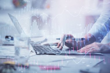 Bilgisayarda ve ön x grafik hologram çiziminde kadın eli yazarken çift pozlama. Borsa yatırım kavramı.