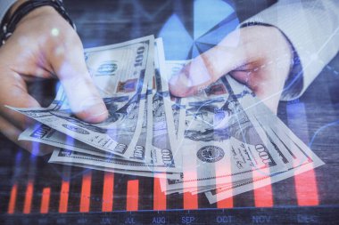 Finansal grafiğe çoklu pozlama hologram, Amerikan dolarları ve insan eli. Analiz kavramı.