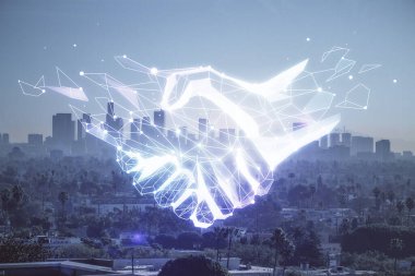 Şehir manzarası arka planında el sıkışma hologramına çifte maruz kalma. Ortaklık kavramı.