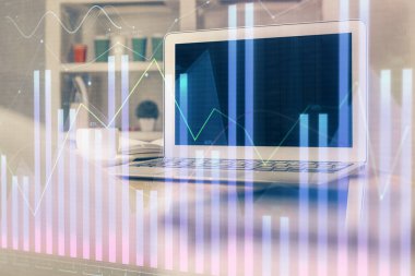 Kişisel bilgisayar arkaplanına çizilmiş borsa hologramı. Çifte maruziyet. Yatırım kavramı.