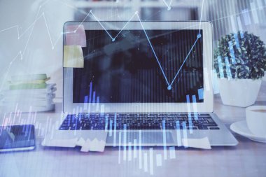 Arka planda eski pazar grafik hologramı ve kişisel bilgisayar var. Çoklu maruz kalma. Yatırım kavramı.