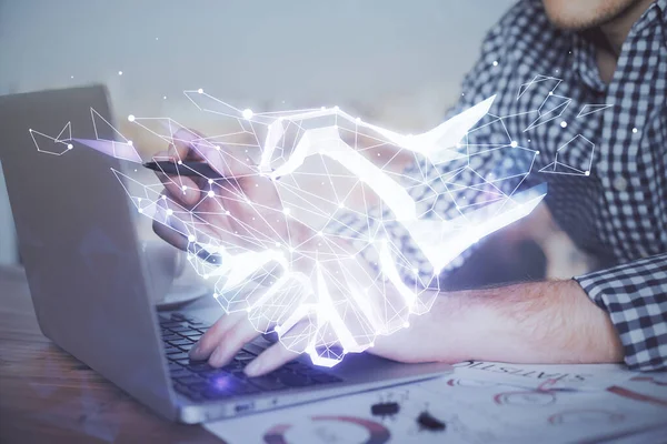 Handshake hologram drawing with businessman working on computer on background. Double exposure. — Stock Photo, Image