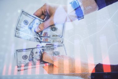 Finansal grafiğe çoklu pozlama hologram, Amerikan dolarları ve insan eli. Analiz kavramı.