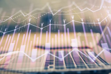 Finansal grafik renkli çizimler ve arka planda bilgisayar olan tablolar. Çoklu maruz kalma. Uluslararası pazarlar kavramı.