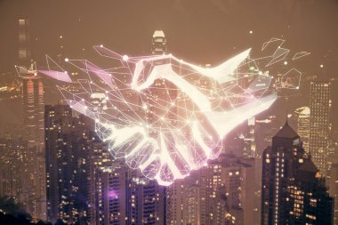Şehir manzarası arka planında el sıkışma hologramına çifte maruz kalma. Ortaklık kavramı.