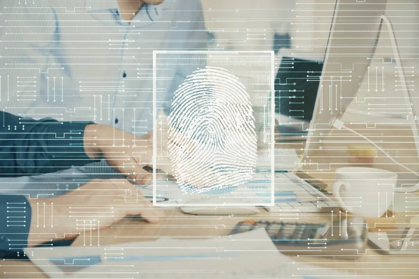 Голограмма отпечатков пальцев с бизнесменом, работающим на компьютере на заднем плане. Концепция безопасности. Двойное воздействие. — стоковое фото