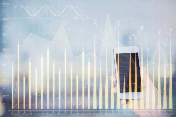 Double exposure of forex chart sketch hologram and woman holding and using a mobile device. Stock market concept.