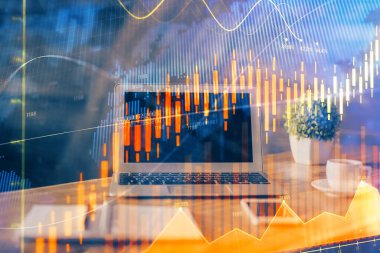 Finansal grafik renkli çizimler ve arka planda bilgisayar olan tablolar. Çifte maruziyet. Uluslararası pazarlar kavramı.