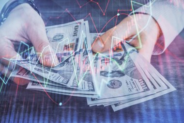 Finansal grafiğe çoklu pozlama hologram, Amerikan dolarları ve insan eli. Analiz kavramı.