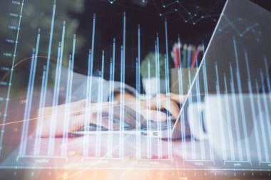 Bilgisayarda ve ön x grafik hologram çiziminde kadın eli yazarken çift pozlama. Borsa yatırım kavramı.