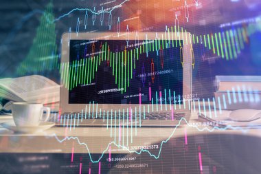 Finansal grafik renkli çizimler ve arka planda bilgisayar olan tablolar. Çoklu maruz kalma. Uluslararası pazarlar kavramı.