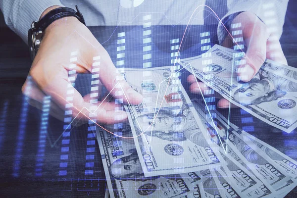 Multi exponering av finansiella diagram rita hologram och USA dollar räkningar och manshänder. Analyskoncept. — Stockfoto