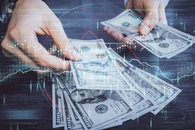 Finansal grafiğe çoklu pozlama hologram, Amerikan dolarları ve insan eli. Analiz kavramı.