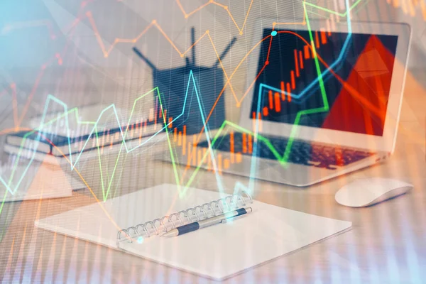 Stock market chart hologram drawn on personal computer background. Double exposure. Concept of investment.