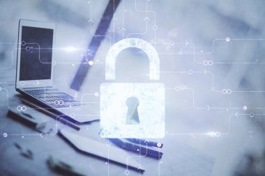 Bilgisayar ve ikon hologramı ile masaüstüne çift pozlama. Veri güvenliği kavramı.