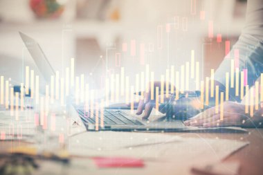 Bilgisayarda ve ön x grafik hologram çiziminde kadın eli yazarken çift pozlama. Borsa yatırım kavramı.