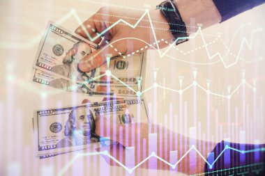 Finansal grafiğe çoklu pozlama hologram, Amerikan dolarları ve insan eli. Analiz kavramı.
