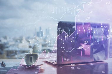 Finansal pazar grafiği hologramı ve kişisel bilgisayar arka planda. Çifte maruziyet. Önx kavramı.