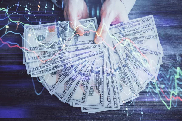 Finansal grafiğe çoklu pozlama hologram, Amerikan dolarları ve insan eli. Analiz kavramı. — Stok fotoğraf