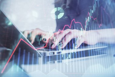 Bilgisayarda ve ön x grafik hologram çiziminde kadın eli yazarken çift pozlama. Borsa yatırım kavramı.