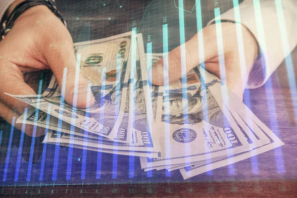 Multi blootstelling van de financiële grafiek tekenen hologram en Amerikaanse dollars rekeningen en man handen. Analyse concept. — Stockfoto