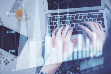 Dizüstü bilgisayar klavyesini ve ön x çizim hologramını yazarken çift pozlama. Üst Manzara. Finans piyasası kavramı.