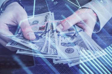 Finansal grafiğe çoklu pozlama hologram, Amerikan dolarları ve insan eli. Analiz kavramı.